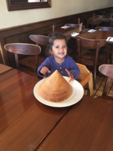 Kid enjoying pyramid dosa